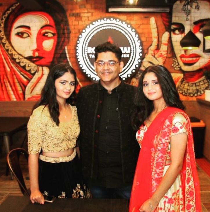 Roti and Chai owner and his daughters